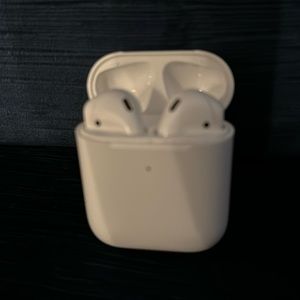 Apple wireless AirPods with charging case and charging cable.
